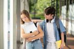 Teenager student comforting sad classmate